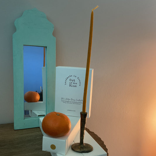 Out of the blue brass candlestick and candle set